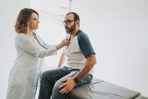 doctor treating patient