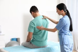 A patient receiving care from a chiropractor. 