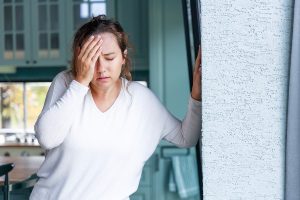 Young woman suffering from dizziness.